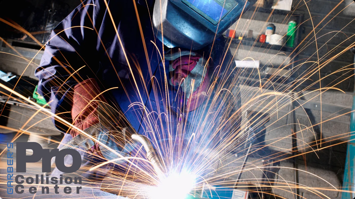Pro Collision Center technician welding in the shop